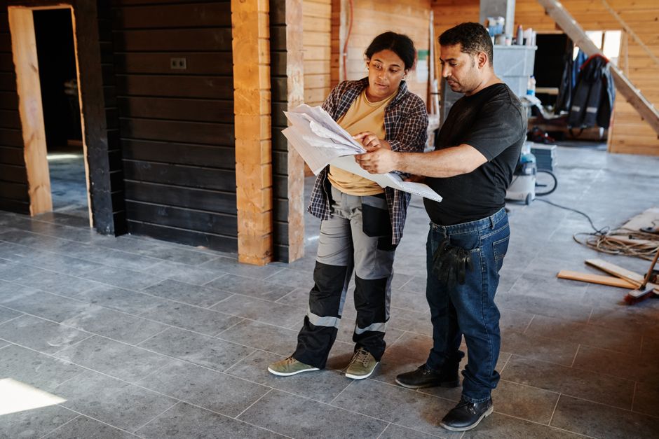 Contractor reviewing bathroom blueprints